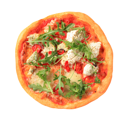 Cheese pizza sprinkled with fresh arugula の写真素材