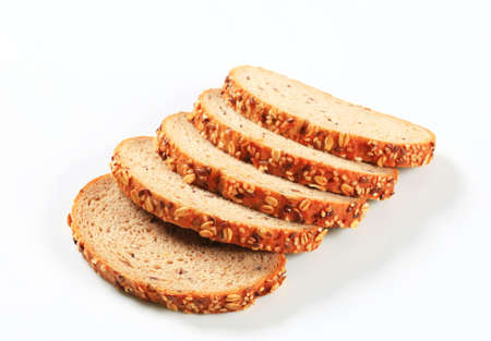 Sliced bread topped with flax and sesame seedsの写真素材