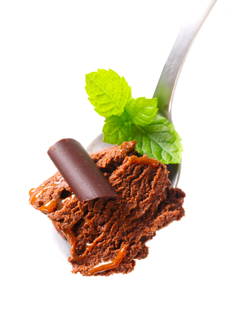 Chocolate fudge ice cream on spoonの写真素材