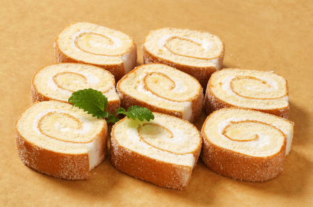 Slices of sponge cake roll with cream fillingの写真素材