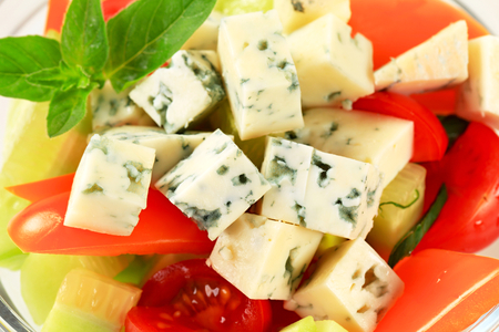 Fresh vegetable salad with diced blue cheeseの写真素材