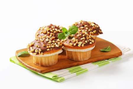 Hazelnut muffins with chocolate toppingの写真素材