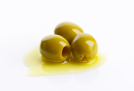Pitted green olives in oilの写真素材