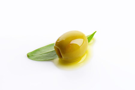 Pitted green olive on white backgroundの写真素材