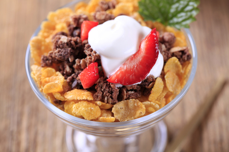 Cornflakes and chocolate granola with sour cream