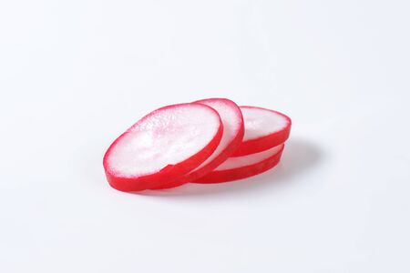 Sliced red radish on white backgroundの写真素材