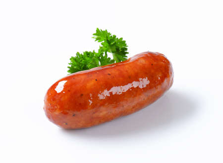 Single cooked beer glazed sausageの写真素材