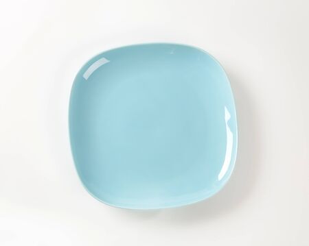 Shallow light blue porcelain square plateの写真素材