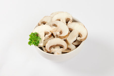 Bowl of sliced fresh mushroomsの写真素材