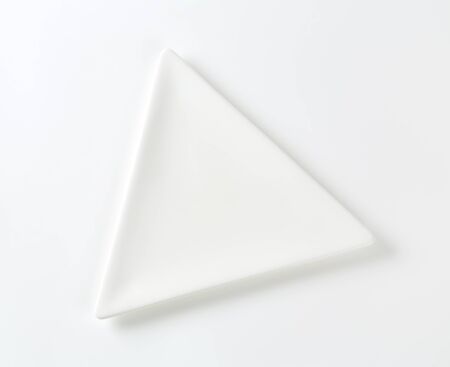 Small triangle plain white appetizer or dessert plateの写真素材