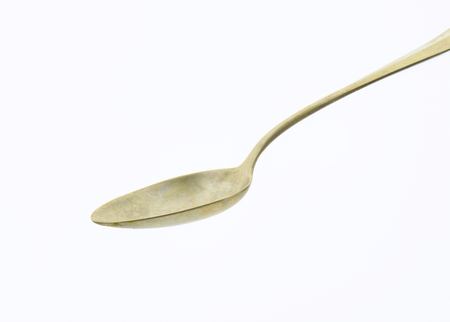 Old silver spoon covered with tarnishの写真素材