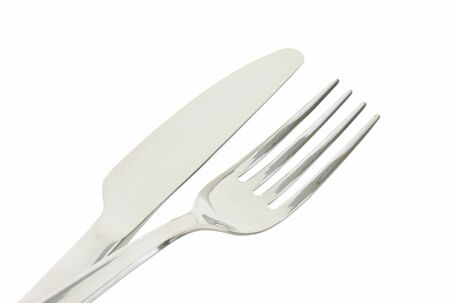 Polished metal dinner knife and fork