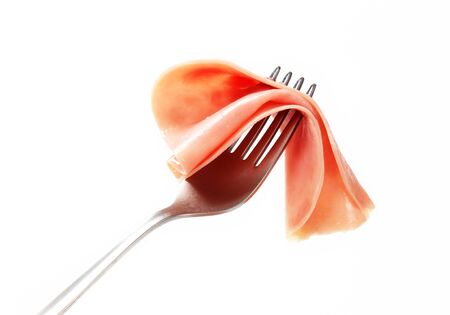 Slice of ham on a forkの写真素材
