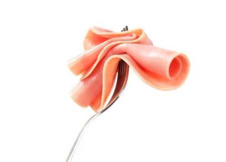 Slice of ham on a forkの写真素材