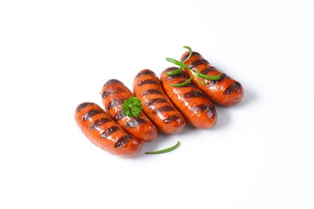 grilled sausages on white backgroundの写真素材