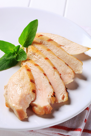 Slices of grilled chicken breast filletの写真素材