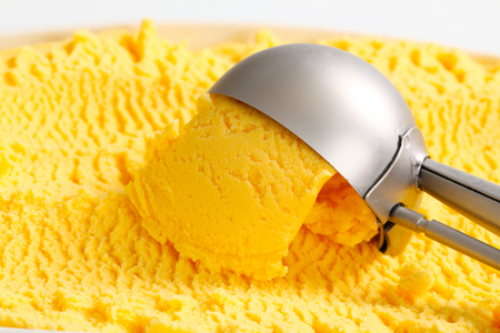 Scoop of yellow ice creamの写真素材