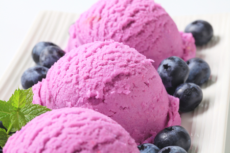 Scoops of blueberry ice cream with fresh berriesの写真素材