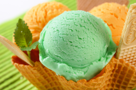 Scoops of ice cream in waffle basketの写真素材