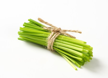 Bunch of fresh chives on white backgroundの写真素材