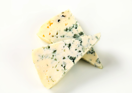 Wedges of blue cheese - studio shotの写真素材