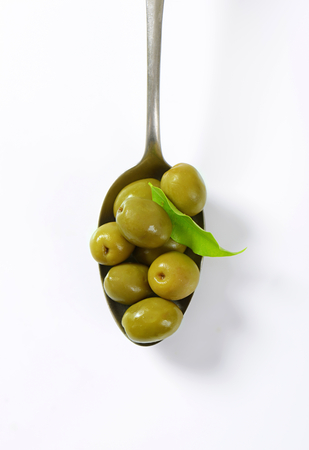 Unpitted brine cured green olivesの写真素材