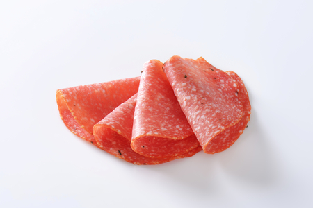 Thinly sliced salami infused with pieces of black trufflesの写真素材