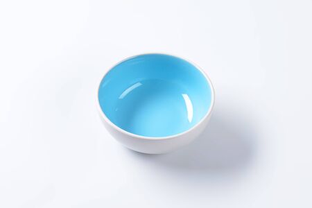 Empty ceramic bowl on white backgroundの写真素材