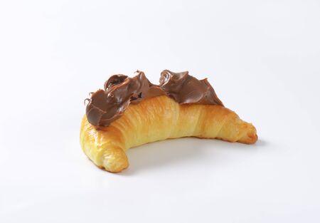 croissant topped with chocolate butter spreadの写真素材