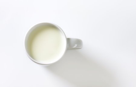 mug of milk on white backgroundの写真素材