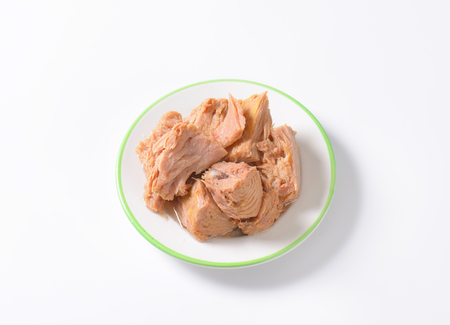 chunks of canned tuna on white plateの写真素材