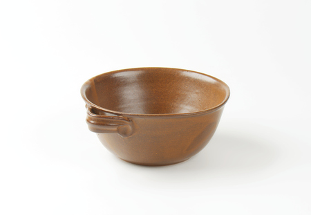empty brown bowl on white backgroundの写真素材