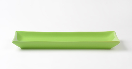 empty green tray on white backgroundの写真素材