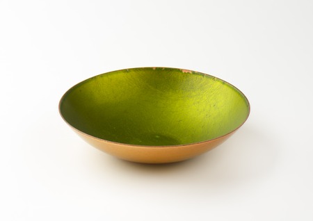 empty green bowl on white backgroundの写真素材