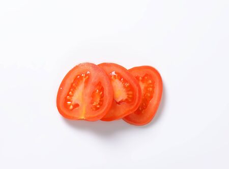 sliced tomato on white backgroundの写真素材