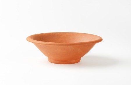 orange bowl on white backgroundの写真素材