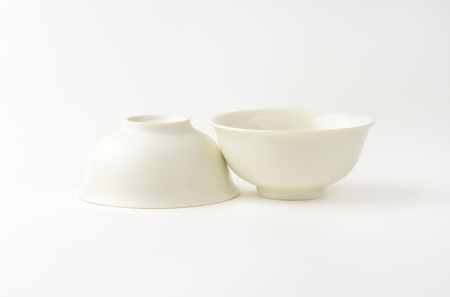 two white bowls on white backgroundの写真素材