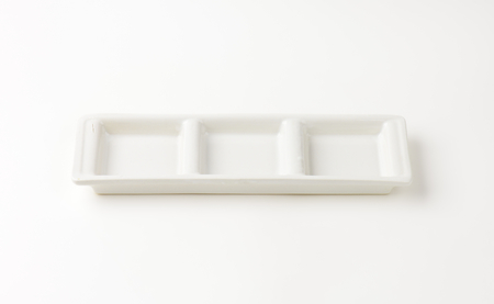 empty white tray on white backgroundの写真素材