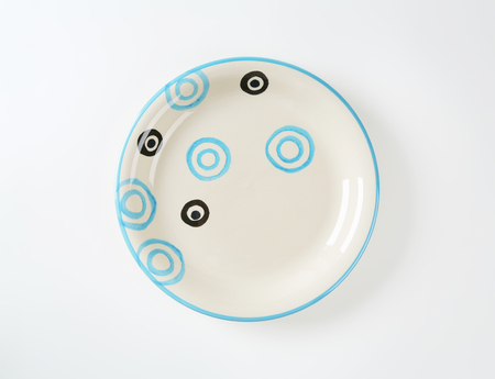 White soup plate with black and blue circlesの写真素材