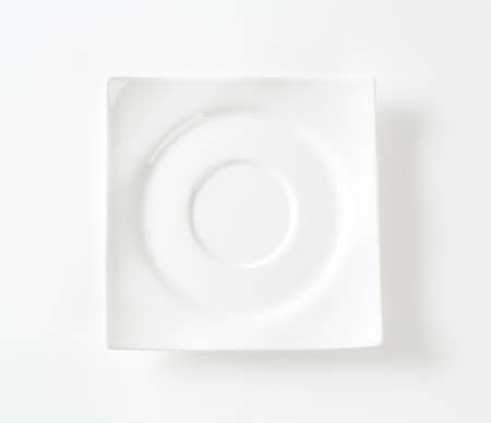white square saucer on white backgroundの写真素材