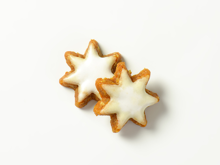 two christmas star cookies on white backgroundの写真素材