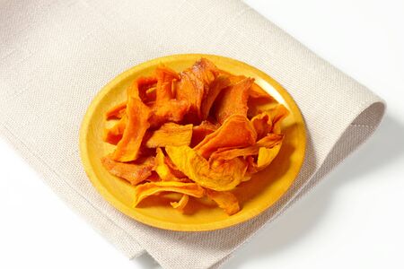 Plate of dried mango slicesの写真素材