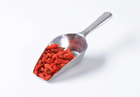Scoop of dried goji berriesの写真素材