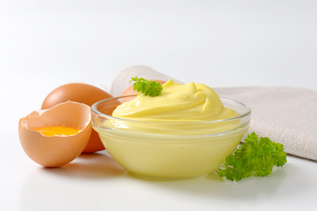 Bowl of homemade mayonnaise and fresh eggsの写真素材