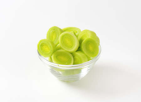 bowl of leek slices on white backgroundの写真素材