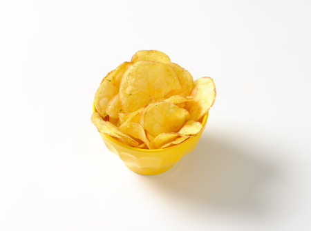 Heap of potato chips in a bowlの写真素材