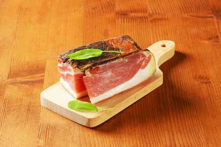 Dry-cured, lightly smoked Italian ham from South Tyrolの写真素材