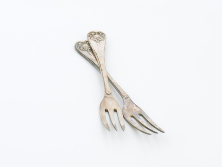 Vintage ornate forks with three tinesの写真素材