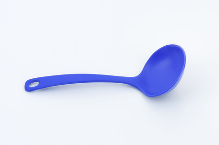 blue ladle on white backgroundの写真素材