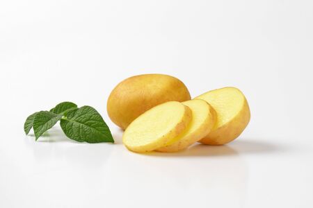 fresh new potatoes on white backgroundの写真素材